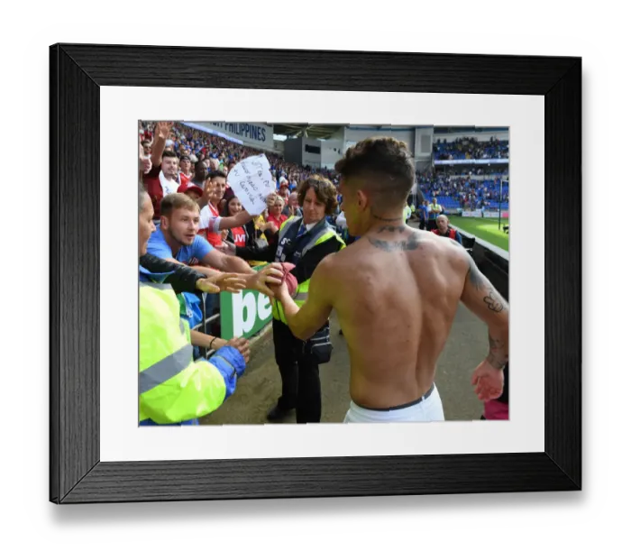 Framed Print : Lucas Torreira's Heartfelt Gesture: Arsenal Star Gives Shirt to Ecstatic Fan at Cardiff City Framed Print : Lucas Torreira's Heartfelt Gesture: Arsenal Star Gives Shirt to Ecstatic Fan at Cardiff City