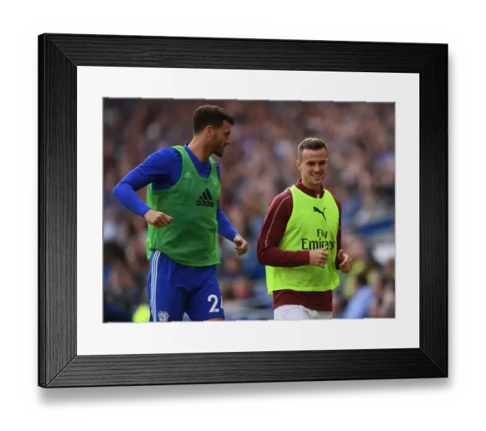 Framed Print : Rob Holding and Gary Madine: A Moment of Respite Amidst the Intensity of Cardiff vs. Arsenal (2018-19)