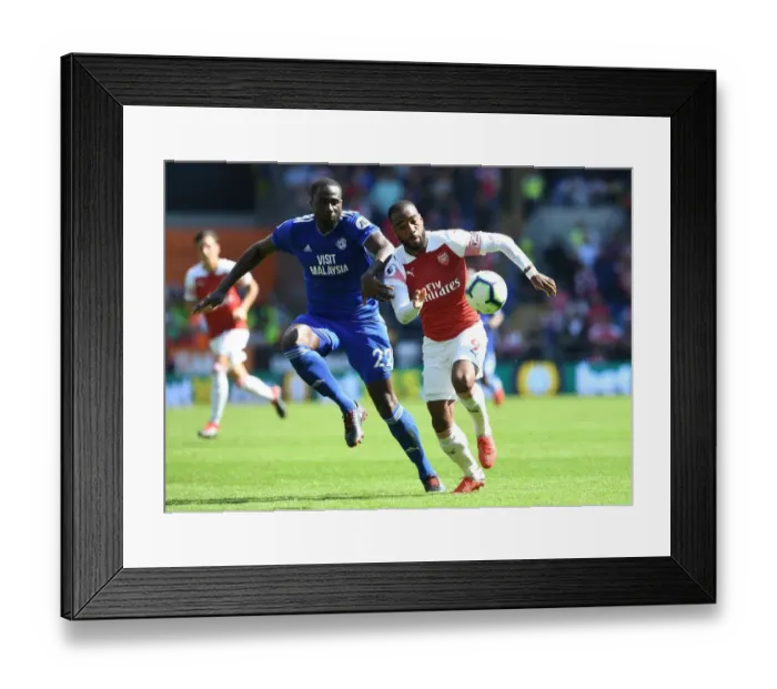 Framed Print : Lacazette vs. Bamba: Clash of the Titans in Cardiff's Premier League Showdown Framed Print : Lacazette vs. Bamba: Clash of the Titans in Cardiff's Premier League Showdown