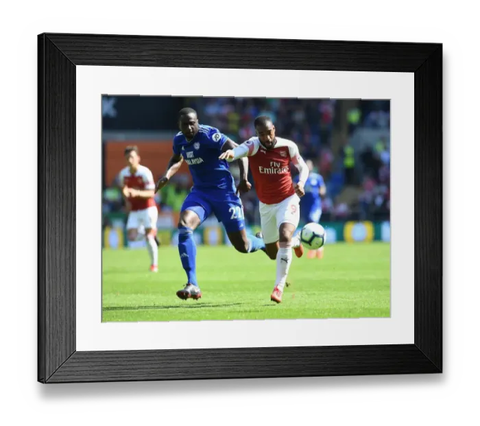 Framed Print : Clash of Titans: Lacazette vs. Bamba - Cardiff City vs. Arsenal FC, Premier League 2018-19