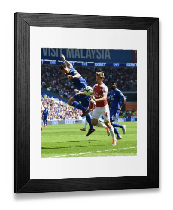 Framed Print : Clash of the Defenders: Monreal vs. Morrison - A Premier League Showdown