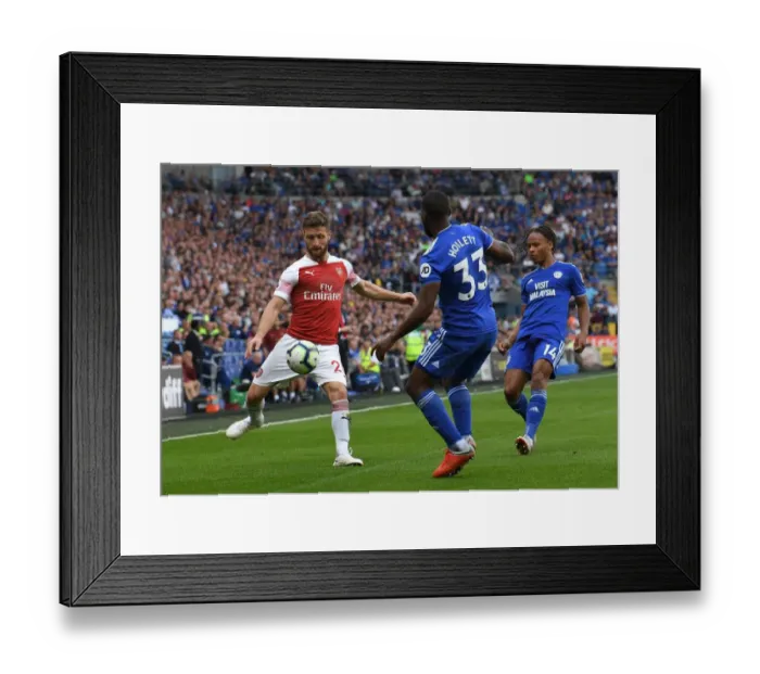 Framed Print : Mustafi Faces Off Against Hoilett: Intense Moment from Cardiff vs. Arsenal (2018-19)