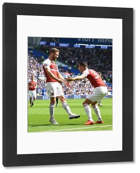 Arsenal's Unified Goal: Mustafi and Xhaka Celebrate at Cardiff City, 2018-19