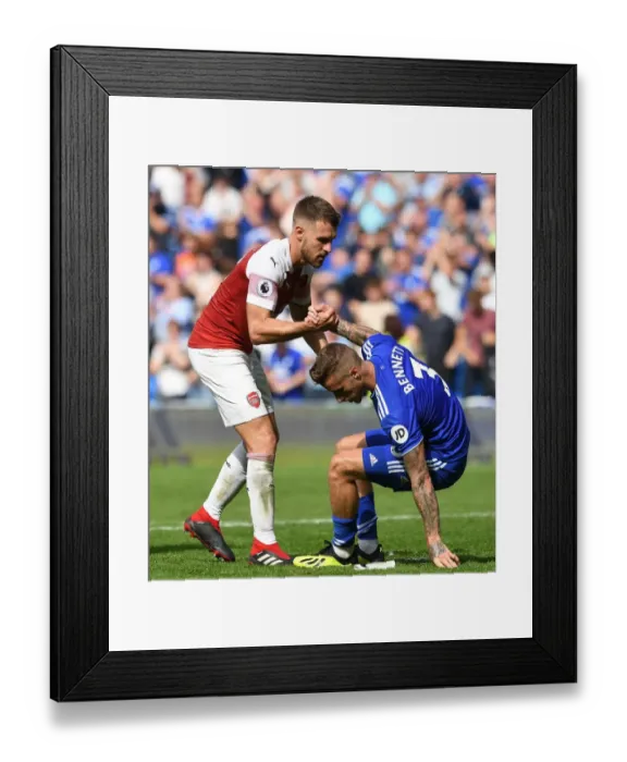 Framed Print : Aaron Ramsey Consoles Joe Bennett after Intense Cardiff vs. Arsenal Clash