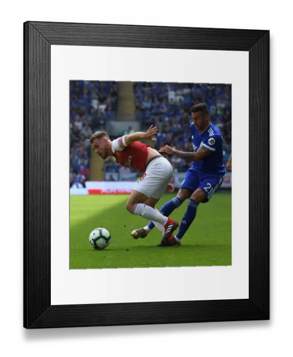 Framed Print : Clarke vs. Xhaka: Cardiff's Camarasa Challenges Arsenal's Ramsey in Premier League Clash Framed Print : Clarke vs. Xhaka: Cardiff's Camarasa Challenges Arsenal's Ramsey in Premier League Clash