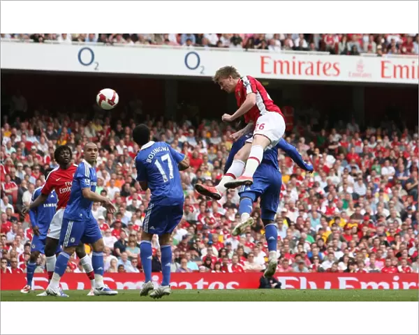 Nicklas Bendtner heads past Chelsea goalkeeper Petr