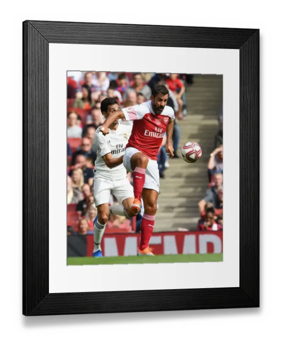 Framed Print : A Clash of Football Greats: Robert Pires Reunites with Arsenal and Real Madrid Legends in London