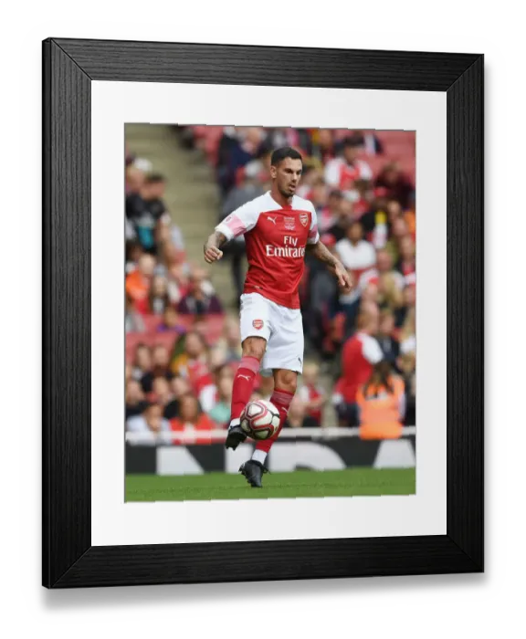Framed Print : Arsenal Legends vs Real Madrid Legends: A Clash of Football Greats - Jeremie Aliadiere in Action
