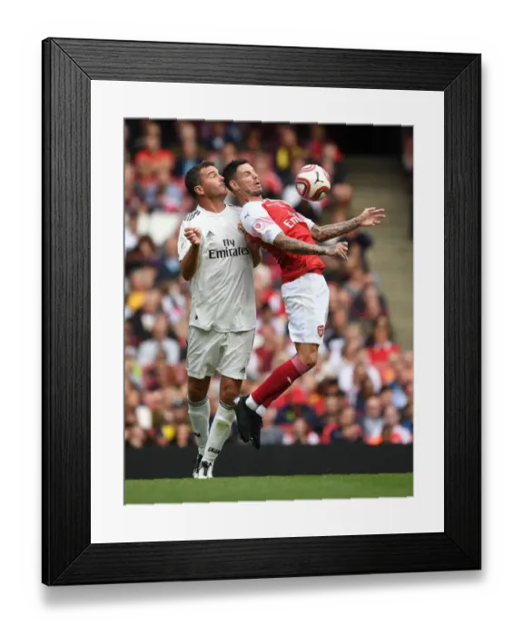 Framed Print : Clash of Football Legends: Aliadiere vs Pavon - Arsenal vs Real Madrid Framed Print : Clash of Football Legends: Aliadiere vs Pavon - Arsenal vs Real Madrid