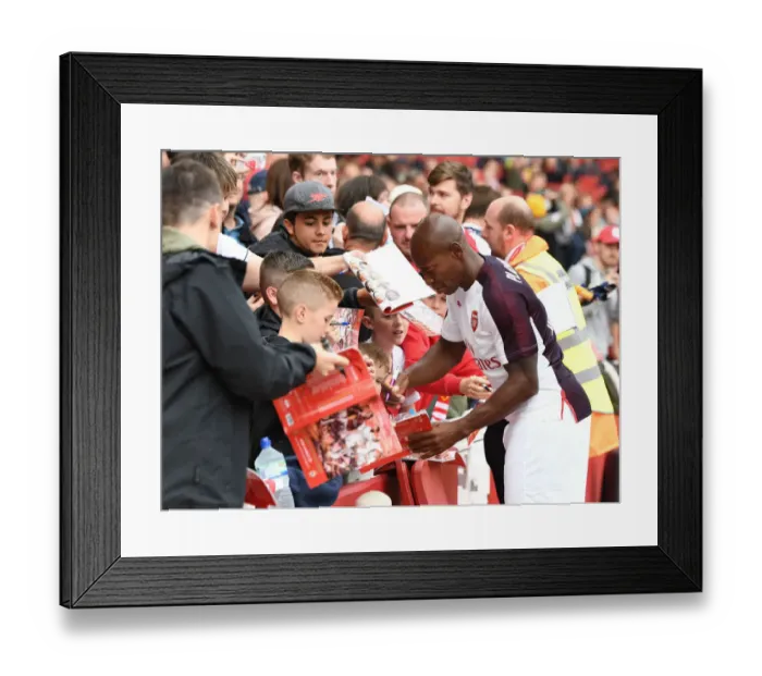 Framed Print : Arsenal Legends vs Real Madrid Legends: A Star-Studded Reunion at Emirates Stadium - Boa Morte and Fans Connect
