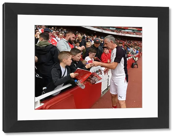 Arsenal Legends vs Real Madrid Legends: Nigel Winterburn Interacts with Fans at Emirates Stadium