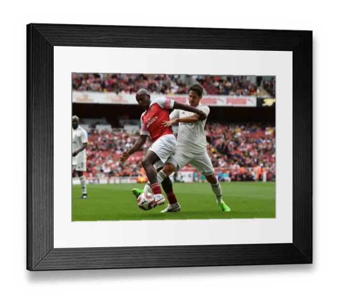 Framed Print : Luis Boa Morte Shines in Arsenal Legends vs Real Madrid Legends Clash: A Battle of Football Greats (2018-19) Framed Print : Luis Boa Morte Shines in Arsenal Legends vs Real Madrid Legends Clash: A Battle of Football Greats (2018-19)