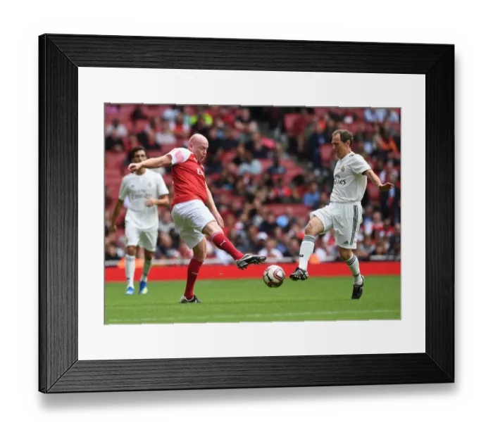 Framed Print : A Clash of Football Legends: Arsenal vs. Real Madrid