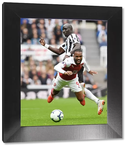 Clash at St. James Park: A Battle Between Lacazette and Diame - Newcastle United vs Arsenal Football Clubs