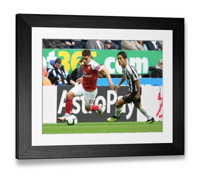 Framed Print : Torreira vs Muto: A Premier League Showdown at St. James Park Framed Print : Torreira vs Muto: A Premier League Showdown at St. James Park