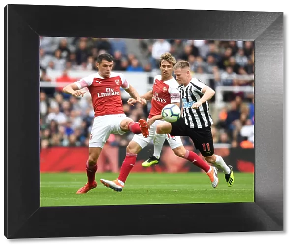 Xhaka and Monreal Go Head-to-Head with Ritchie in Intense Newcastle-Arsenal Clash