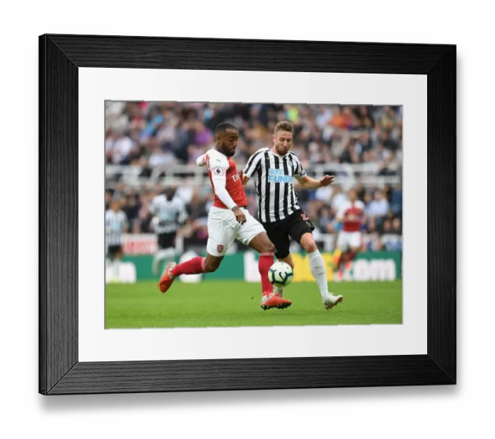 Framed Print : Lacazette vs. Dummett: A Football Rivalry Unfolds at St. James Park Framed Print : Lacazette vs. Dummett: A Football Rivalry Unfolds at St. James Park