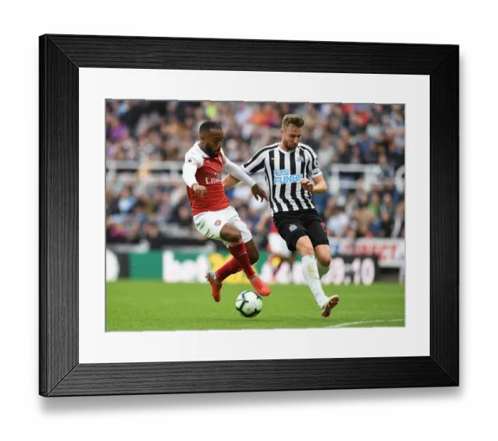 Framed Print : Lacazette vs. Dummett: A Premier League Showdown at St. James Park