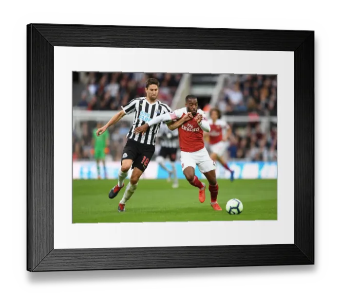 Framed Print : Clash at St. James Park: Lacazette vs. Fernandez - Newcastle United vs. Arsenal FC, Premier League 2018-19