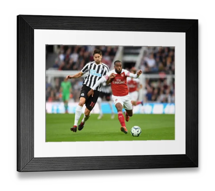 Framed Print : Clash at St. James Park: A Battle Between Lacazette and Fernandez - Arsenal vs. Newcastle United, Premier League 2018-19