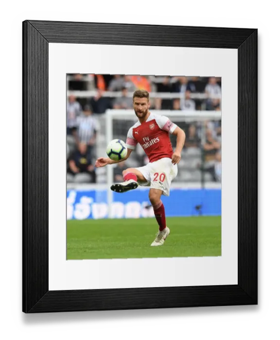 Framed Print : Shkodran Mustafi: Unwavering Concentration Amid Newcastle United vs Arsenal FC Clash (2018-19)