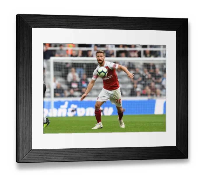 Framed Print : Shkodran Mustafi Focuses in Newcastle United vs Arsenal FC Clash (2018-19)