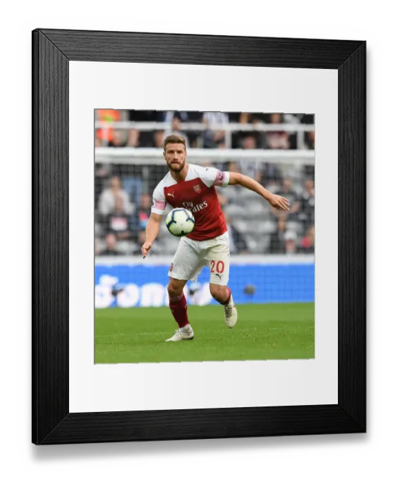 Framed Print : Shkodran Mustafi's Unwavering Focus: Arsenal Defender's Intense Concentration Amidst Newcastle United Clash (2018-19) Framed Print : Shkodran Mustafi's Unwavering Focus: Arsenal Defender's Intense Concentration Amidst Newcastle United Clash (2018-19)