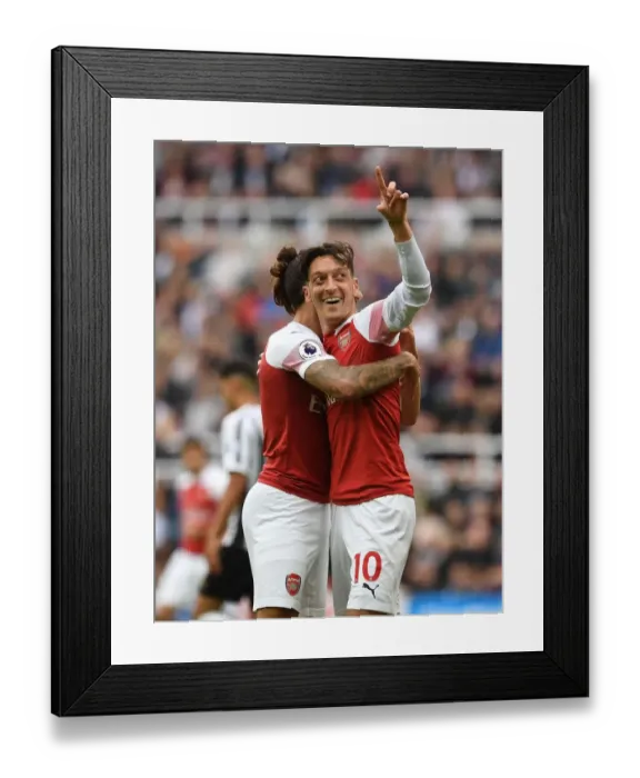 Framed Print : Arsenal's Winning Partnership: Ozil and Bellerin Celebrate Goals vs. Newcastle United Framed Print : Arsenal's Winning Partnership: Ozil and Bellerin Celebrate Goals vs. Newcastle United