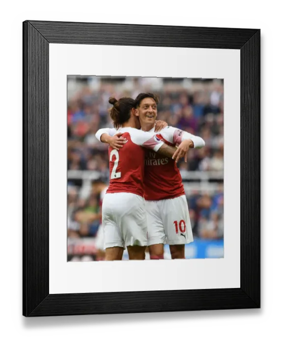 Framed Print : Arsenal's Ozil and Bellerin: A Celebratory Moment after Scoring against Newcastle United Framed Print : Arsenal's Ozil and Bellerin: A Celebratory Moment after Scoring against Newcastle United