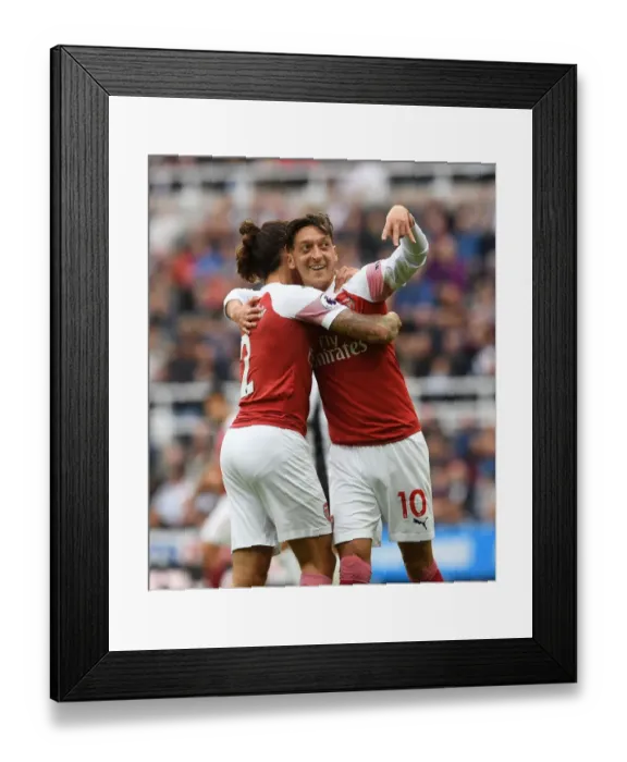 Framed Print : Arsenal's Unstoppable Duo: Ozil and Bellerin Celebrate Goal vs Newcastle United (2018-19) Framed Print : Arsenal's Unstoppable Duo: Ozil and Bellerin Celebrate Goal vs Newcastle United (2018-19)