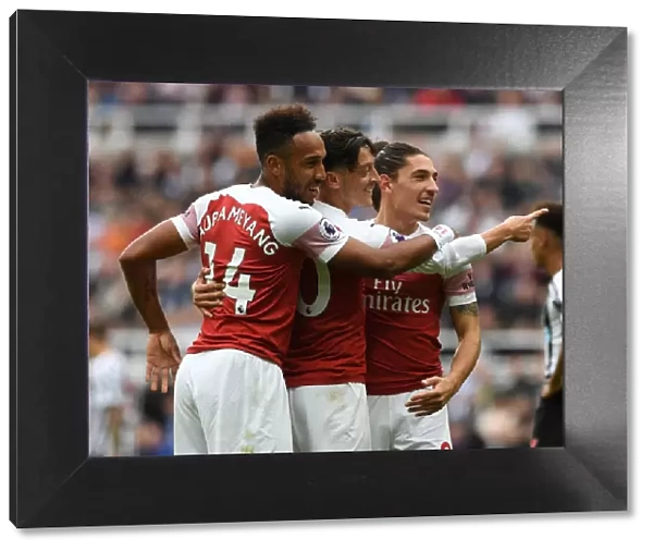 Arsenal's Triumph: Ozil, Bellerin, Aubameyang Celebrate Goals Against Newcastle United