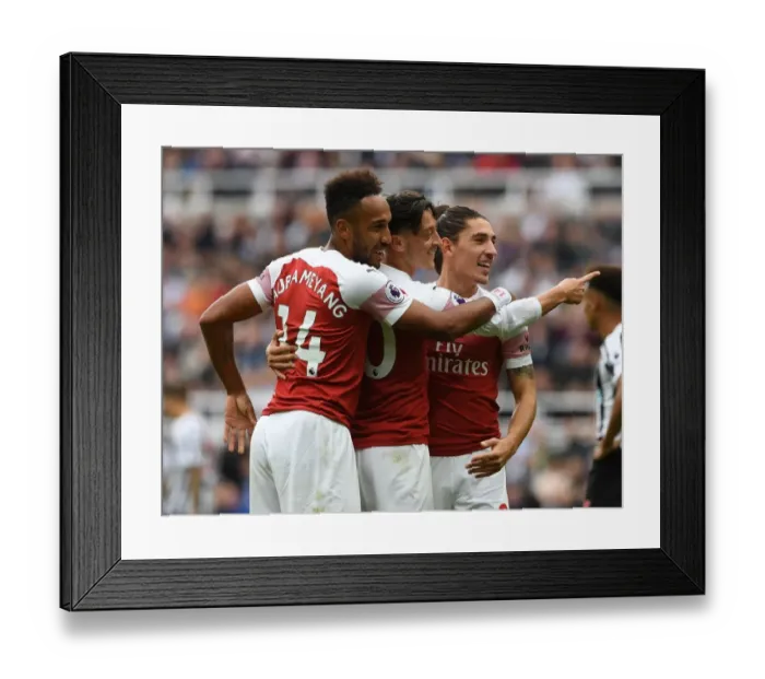 Framed Print : Arsenal's Triumph: Ozil, Bellerin, Aubameyang Celebrate Goals Against Newcastle United Framed Print : Arsenal's Triumph: Ozil, Bellerin, Aubameyang Celebrate Goals Against Newcastle United