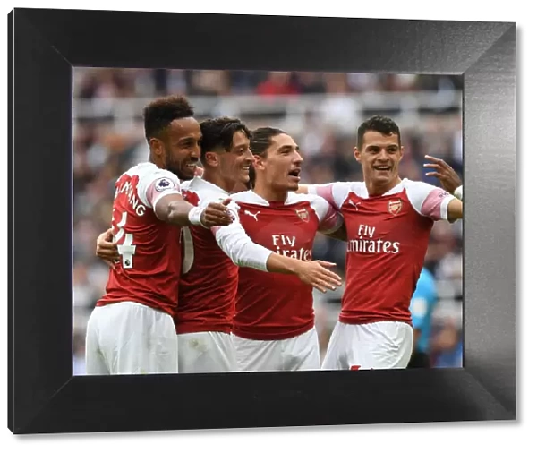 Arsenal's Ozil, Bellerin, Aubameyang, and Xhaka Celebrate Goals Against Newcastle United