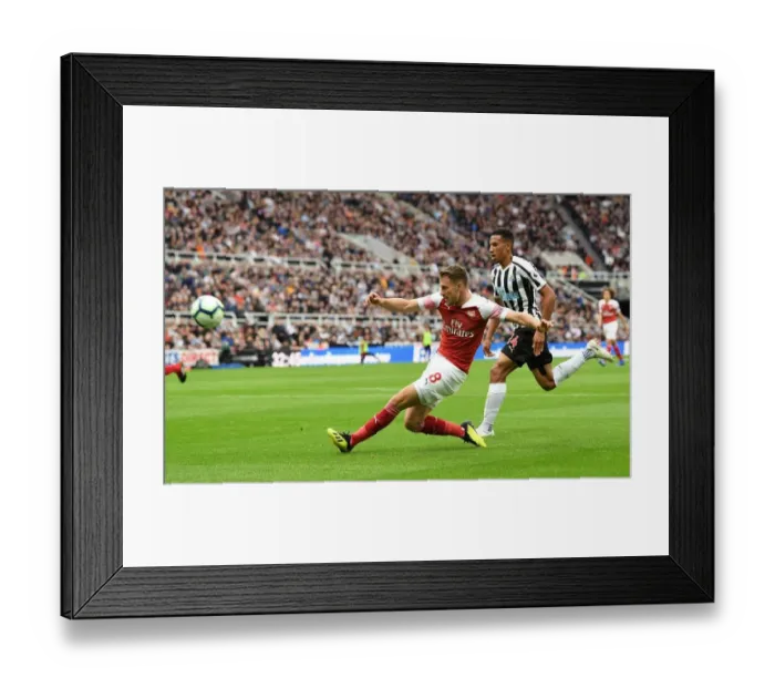 Framed Print : Aaron Ramsey vs. Isaac Hayden: Intense Battle in Newcastle United vs. Arsenal FC Premier League Clash
