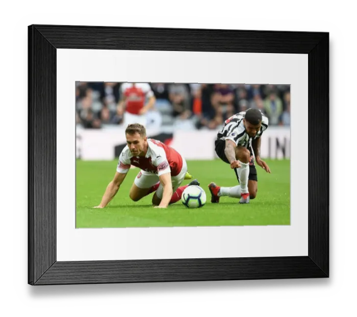 Framed Print : Ramsey vs. Kenedy: A Premier League Showdown at St. James Park Framed Print : Ramsey vs. Kenedy: A Premier League Showdown at St. James Park
