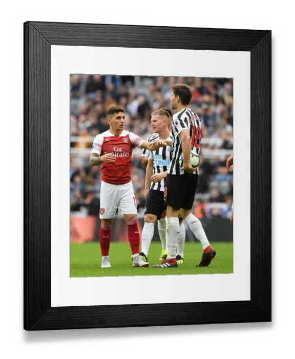 Framed Print : Torreira vs. Fernandez: Intense Battle in Newcastle United vs. Arsenal FC Premier League Clash Framed Print : Torreira vs. Fernandez: Intense Battle in Newcastle United vs. Arsenal FC Premier League Clash
