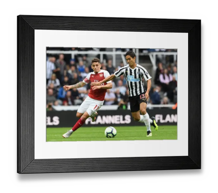 Framed Print : Torreira vs. Muto: A Premier League Battle at St. James Park - Arsenal's Torreira Clashes with Newcastle's Muto