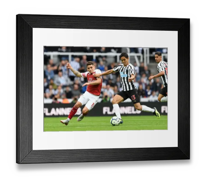 Framed Print : Torreira vs Muto: A Fierce Battle in Newcastle United vs Arsenal FC Premier League Clash - The Duel at St. James Park