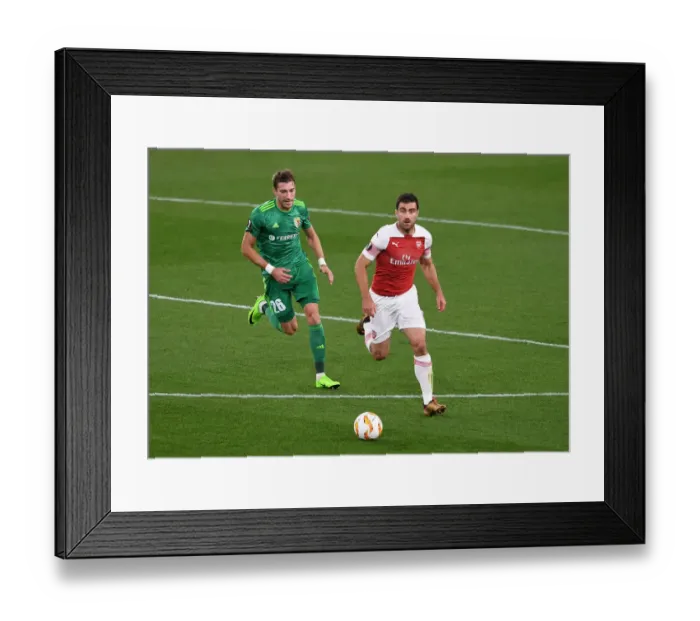 Framed Print : Sokratis vs. Kolomoets: A Europa League Showdown at Emirates Stadium