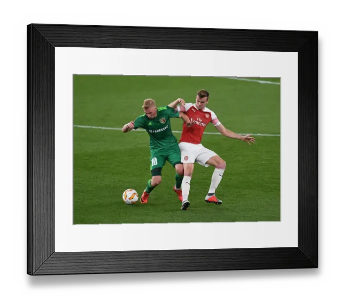 Framed Print : Arsenal vs Vorskla Poltava: Rob Holding Tackles Vladyslav Kulach in Europa League Clash Framed Print : Arsenal vs Vorskla Poltava: Rob Holding Tackles Vladyslav Kulach in Europa League Clash
