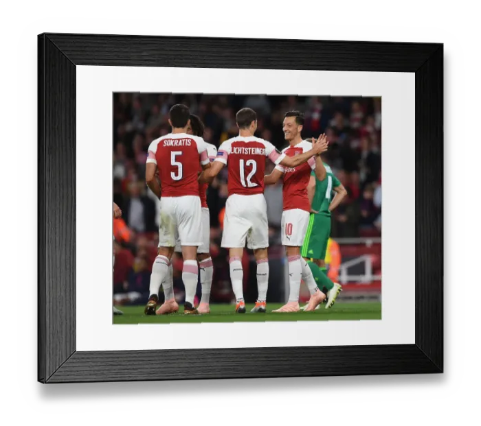 Framed Print : Arsenal's Ozil and Lichtsteiner: Unstoppable Duo Celebrates Goals Against Vorskla Poltava