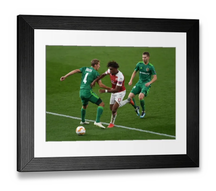 Framed Print : Arsenal's Alex Iwobi Clashes with Vorskla's Kobakhidze and Perduta in Europa League Match