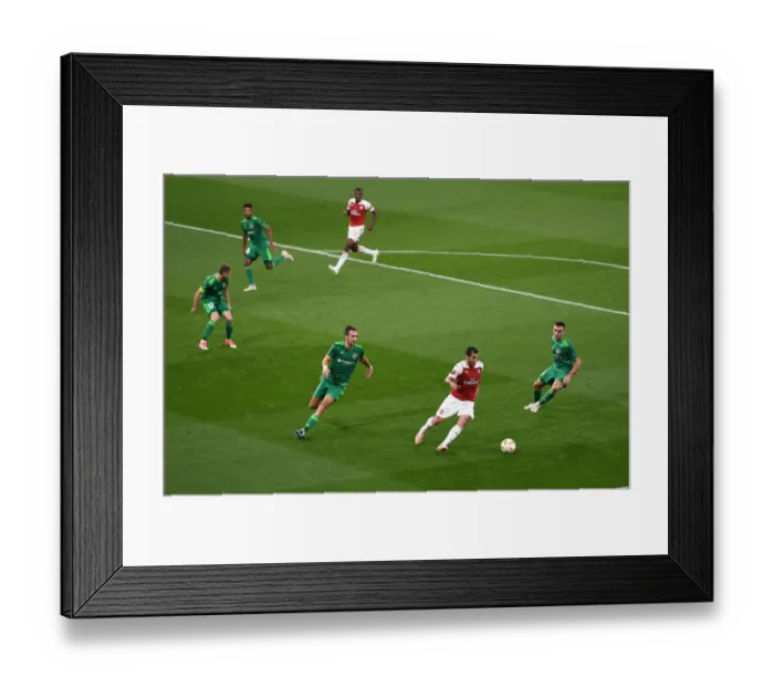 Framed Print : Arsenal's Mkhitaryan Faces Off Against Vorskla's Sharpar in Europa League Clash Framed Print : Arsenal's Mkhitaryan Faces Off Against Vorskla's Sharpar in Europa League Clash