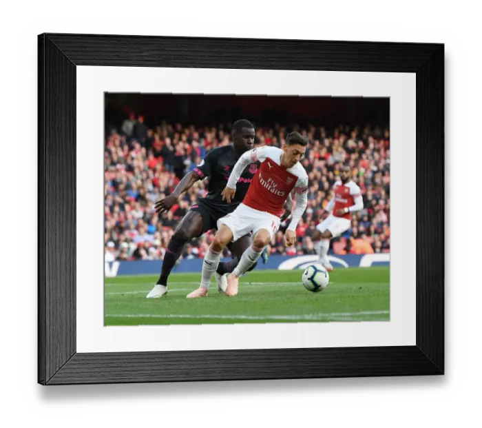 Framed Print : Mesut Ozil vs Kurt Zouma: Battle at Emirates Stadium - Arsenal v Everton, Premier League 2018-19
