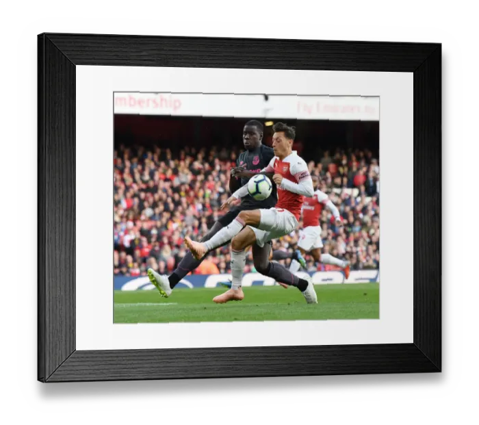 Framed Print : Mesut Ozil vs. Kurt Zouma: Battle at Emirates Stadium - Arsenal v Everton, Premier League 2018-19