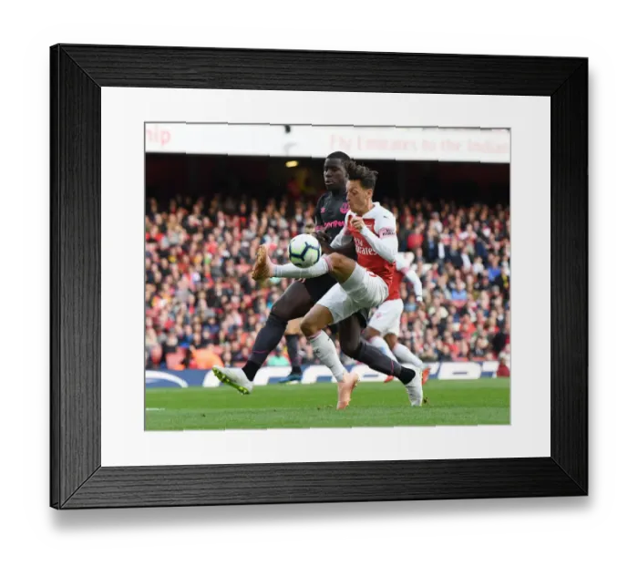Framed Print : Mesut Ozil vs Kurt Zouma: A Midfield Duel at Emirates Stadium - Arsenal vs Everton, Premier League 2018-19