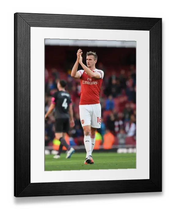 Framed Print : Arsenal's Rob Holding Celebrates with Fans after Arsenal v Everton Match Framed Print : Arsenal's Rob Holding Celebrates with Fans after Arsenal v Everton Match