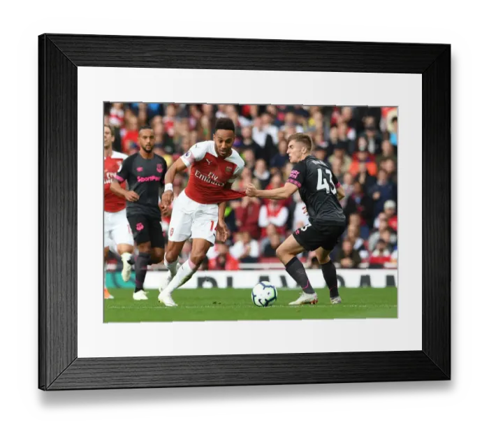 Framed Print : Arsenal's Aubameyang Clashes with Everton's Kenny in Premier League Showdown