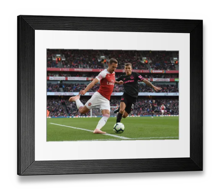 Framed Print : Arsenal's Ramsey Faces Off Against Everton's Digne in Premier League Clash