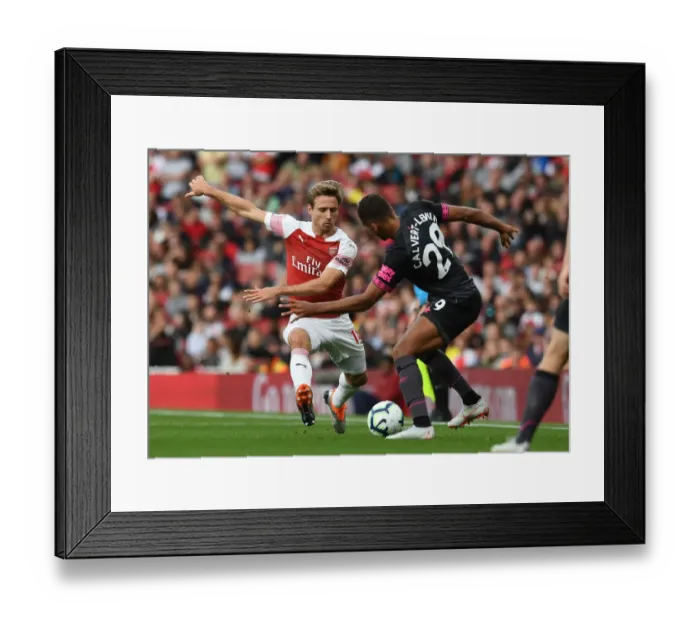 Framed Print : Clash at Emirates: Monreal vs Calvert-Lewin in Arsenal's Battle Against Everton (2018-19)